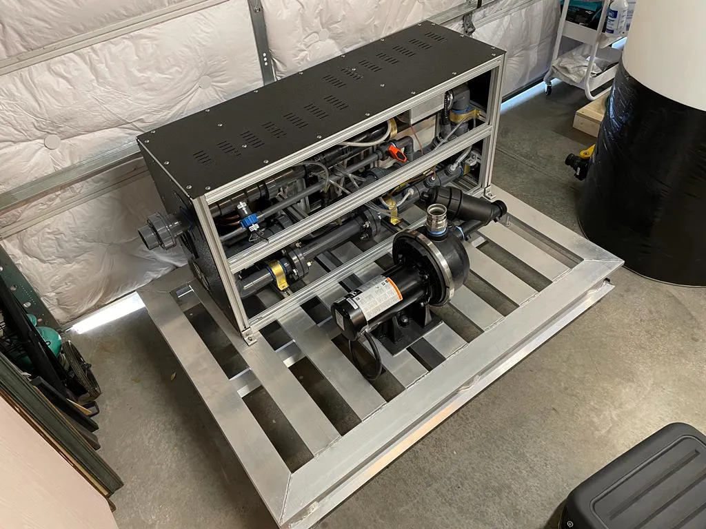 Photograph of the constructed CTR-PACK module on its aluminium skid, with the pump and motor mounted at the front.